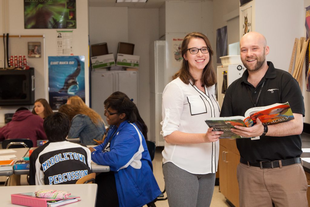 Student teachers working along with high school teachers and students at Middletown High School. (These students are released according to the high school but UD does not have the releases on file - check with Sue Gleason before using.)