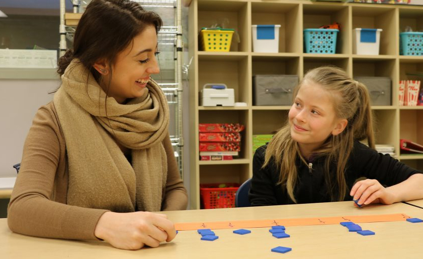 Teacher shows child number line